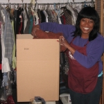 Gayle Chillious of Caring Transitions packs clothing for a client.